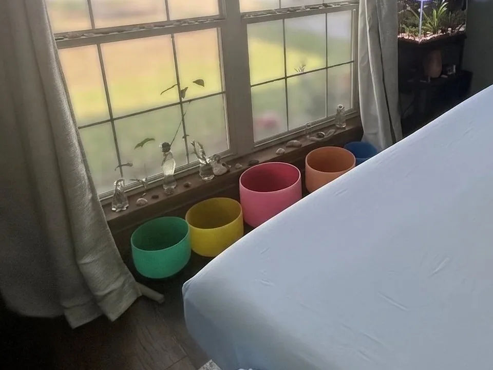 Crystal singing bowls set out in the studio